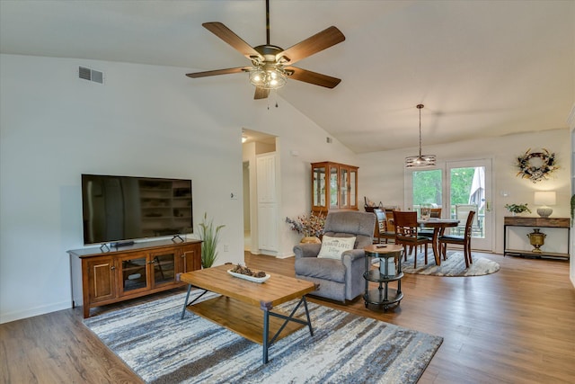 212 Links Pl, Mccormick, SC 29835 - living area with lofted ceiling, ceiling fan, wood finished floors, and baseboards