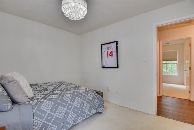 212 Links Pl, Mccormick, SC 29835 - carpeted bedroom with a chandelier and baseboards