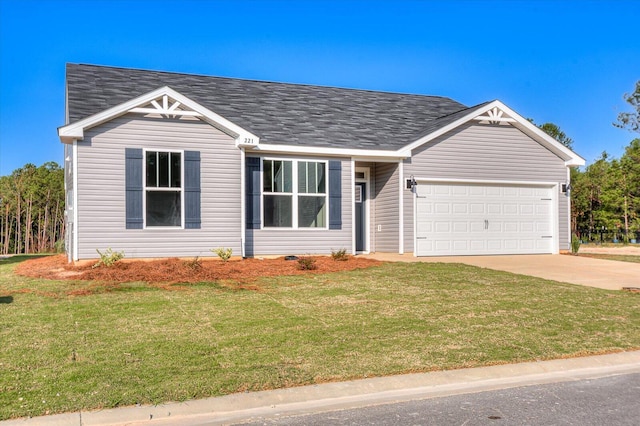 ranch-style home with a garage and a front lawn