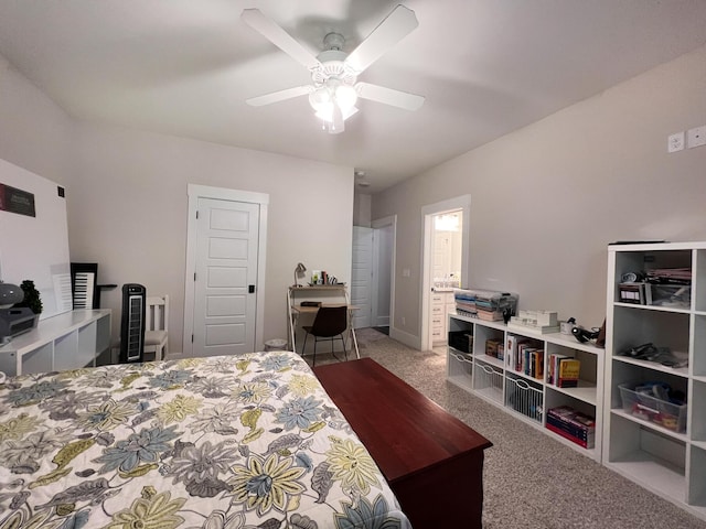 bedroom featuring ensuite bath, light colored carpet, and ceiling fan