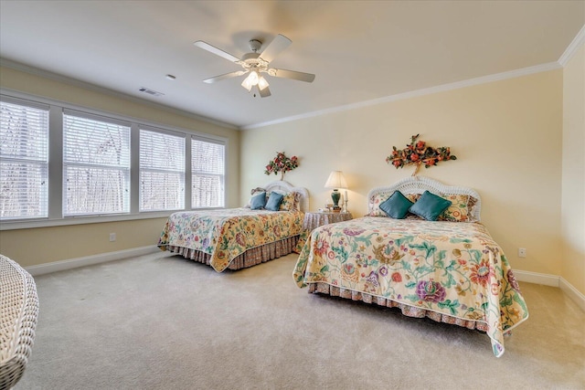 bedroom with ceiling fan, carpet floors, and ornamental molding