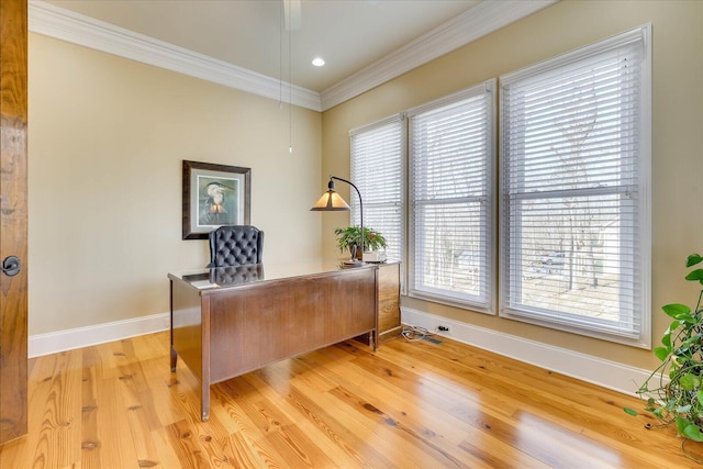 office space with crown molding, light hardwood / wood-style floors, and plenty of natural light