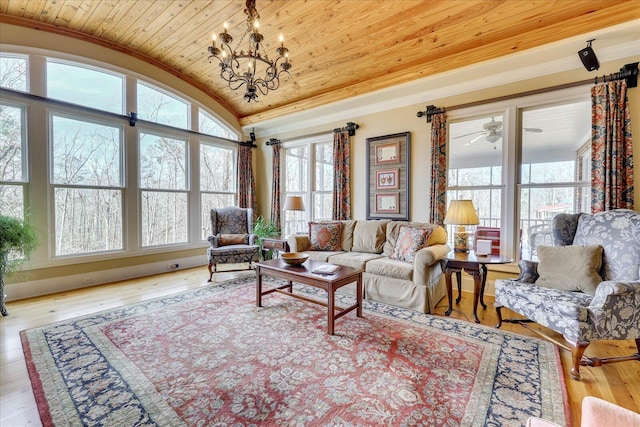 living room featuring light hardwood / wood-style floors, ornamental molding, wood ceiling, and ceiling fan with notable chandelier