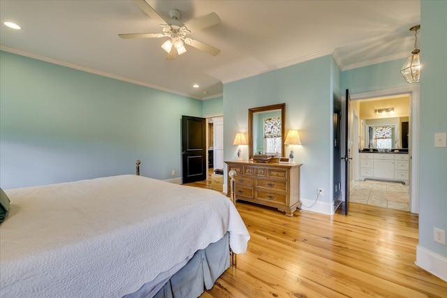 bedroom featuring ceiling fan, crown molding, connected bathroom, and light hardwood / wood-style flooring