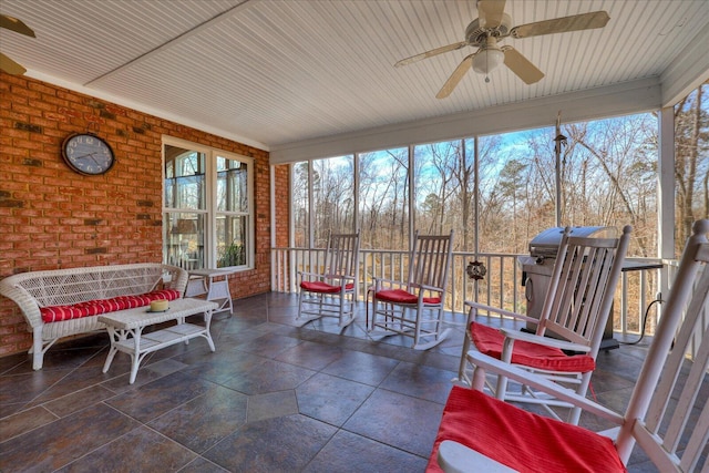 sunroom / solarium with ceiling fan