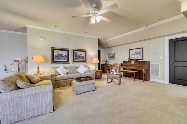 carpeted living room with ceiling fan, vaulted ceiling, and ornamental molding