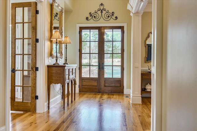 doorway to outside with light hardwood / wood-style floors and french doors