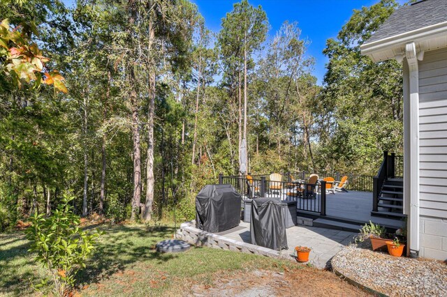 view of yard with a wooden deck