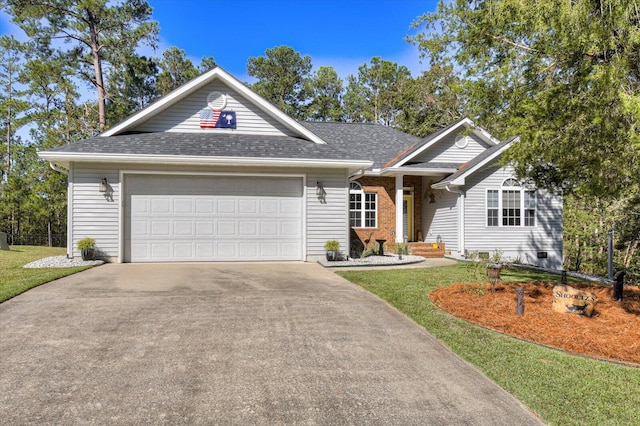 ranch-style home featuring a garage and a front lawn