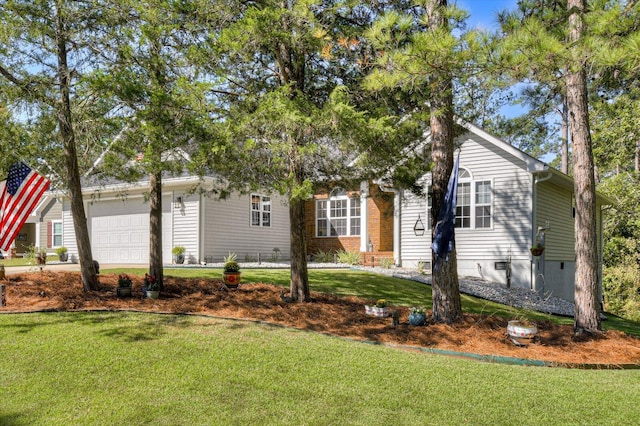 view of front of home with a garage and a front lawn