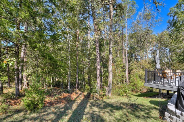 view of yard with a wooden deck