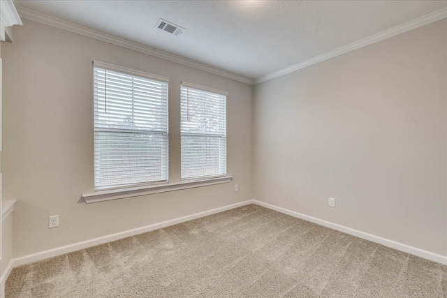 carpeted spare room with ornamental molding