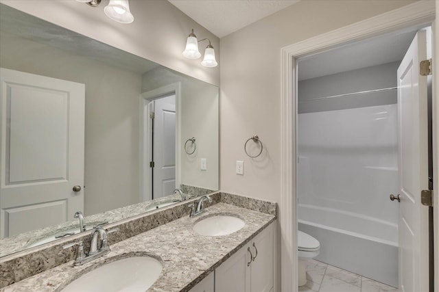 full bathroom with vanity, toilet, and  shower combination