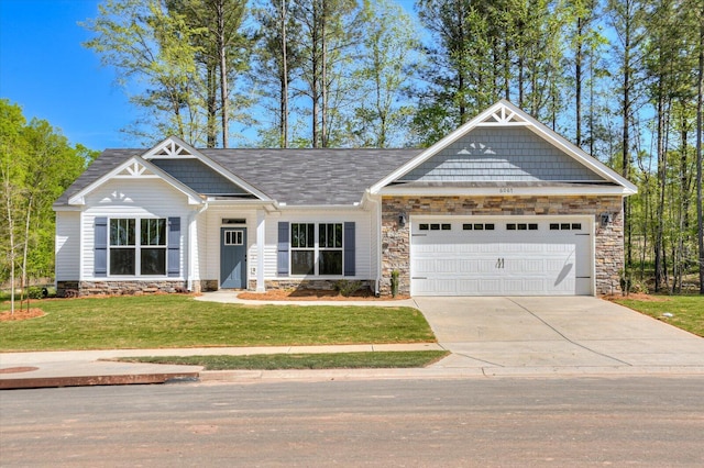 craftsman inspired home with a front yard and a garage