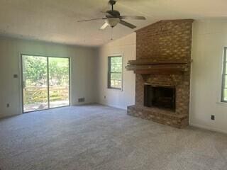 4521 Zola Dr, Evans, GA 30809 - unfurnished living room featuring carpet, a ceiling fan, a brick fireplace, and vaulted ceiling