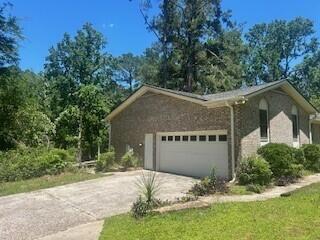4521 Zola Dr, Evans, GA 30809 - view of side of home featuring a garage and concrete driveway