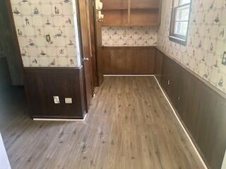 4521 Zola Dr, Evans, GA 30809 - detailed view of wainscoting, wood finished floors, and wallpapered walls
