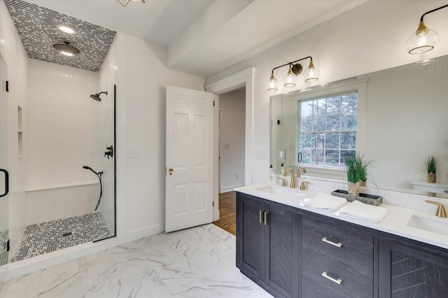 bathroom with vanity and a shower with shower door