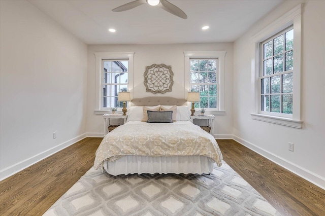 bedroom featuring hardwood / wood-style floors and ceiling fan