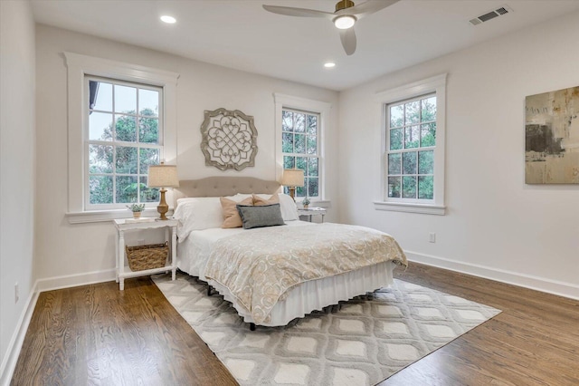 bedroom featuring hardwood / wood-style floors and ceiling fan