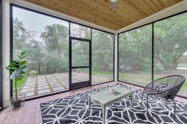 unfurnished sunroom with a healthy amount of sunlight and wooden ceiling