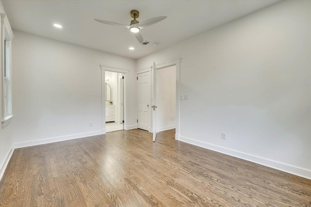 unfurnished room featuring hardwood / wood-style flooring and ceiling fan