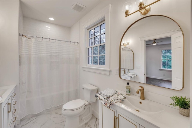 full bathroom featuring shower / bath combo, vanity, toilet, and ceiling fan