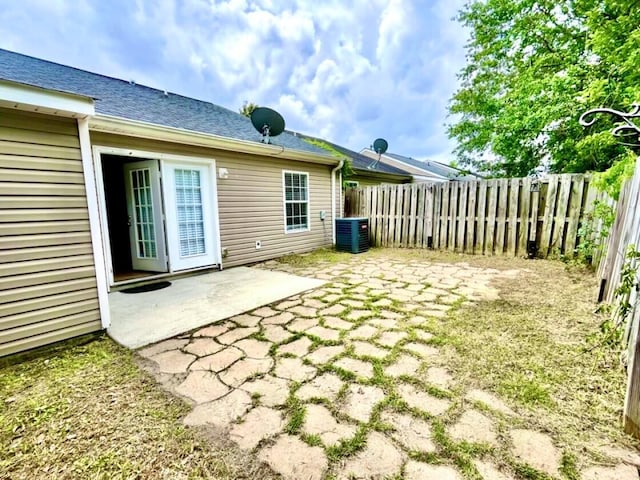 1235 Longpoint Dr, Augusta, GA 30906 - back of house featuring fence, roof with shingles, central AC, and a patio
