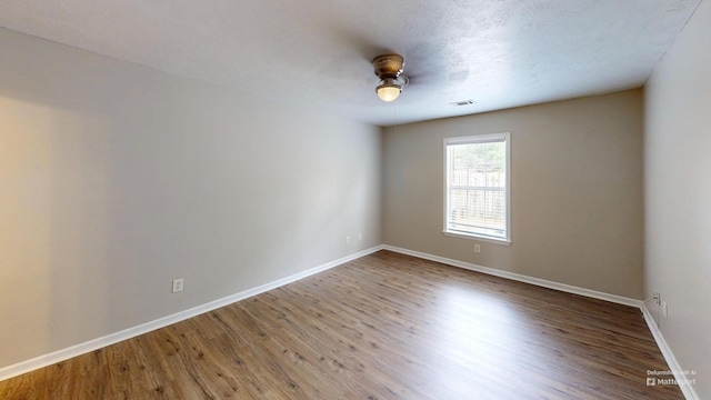 1235 Longpoint Dr, Augusta, GA 30906 - unfurnished room with wood finished floors, visible vents, and baseboards