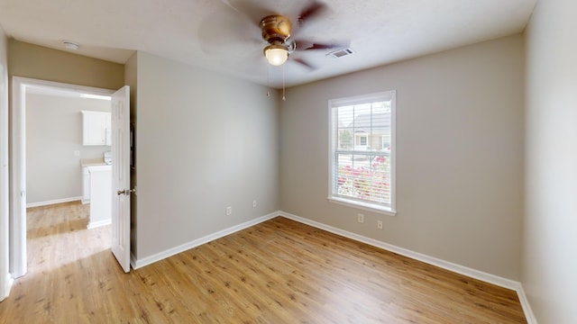 1235 Longpoint Dr, Augusta, GA 30906 - empty room with a ceiling fan, visible vents, and light wood-style floors