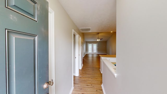 1235 Longpoint Dr, Augusta, GA 30906 - hallway featuring an upstairs landing, visible vents, light wood-style flooring, and baseboards