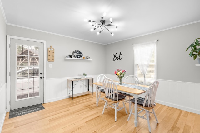 3973 Concord Pl, Martinez, GA 30907 - dining space featuring wood finished floors, a chandelier, a wainscoted wall, and ornamental molding