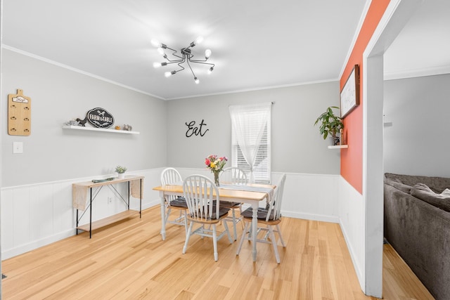 3973 Concord Pl, Martinez, GA 30907 - dining area featuring wood finished floors, wainscoting, crown molding, and a chandelier