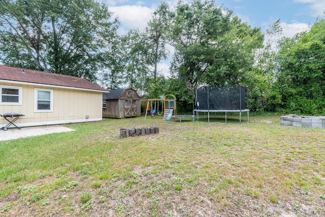 3973 Concord Pl, Martinez, GA 30907 - view of green lawn featuring a trampoline, a shed, a playground, and a patio area