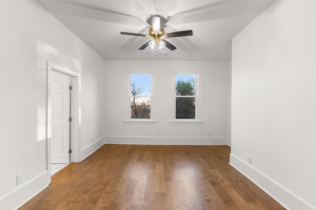 spare room featuring hardwood / wood-style flooring and ceiling fan