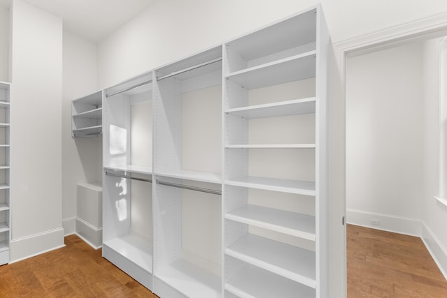 spacious closet featuring hardwood / wood-style flooring