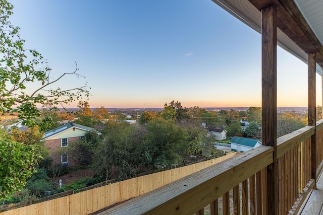 view of balcony at dusk