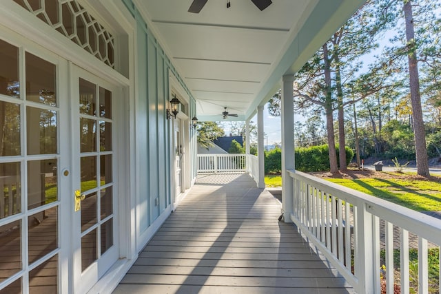 deck with covered porch and ceiling fan