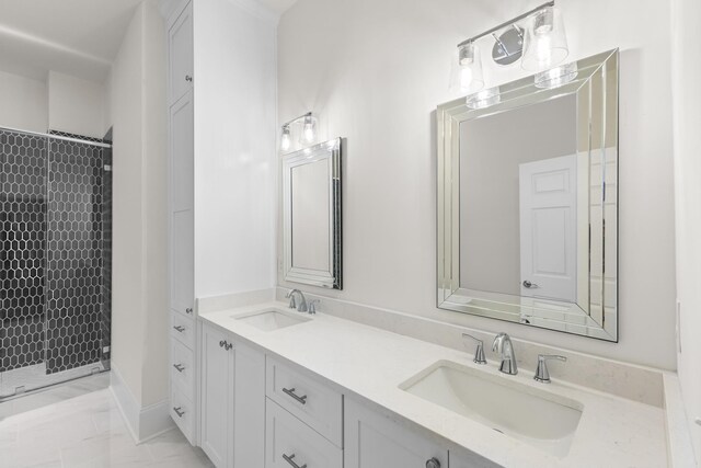 bathroom with vanity and a shower with shower door