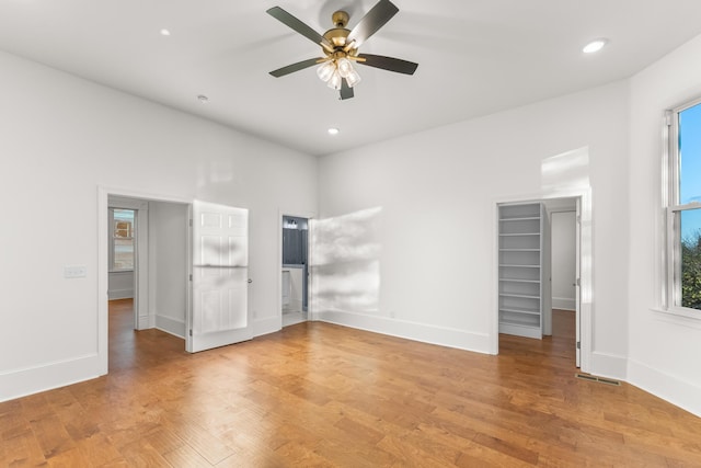 unfurnished bedroom featuring hardwood / wood-style flooring and ceiling fan