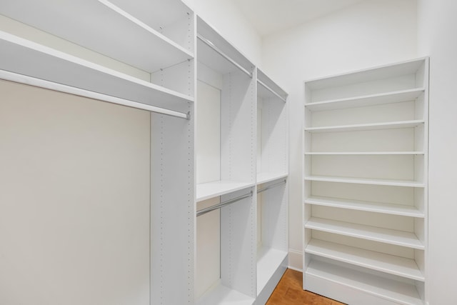 walk in closet featuring hardwood / wood-style flooring