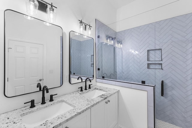 bathroom with vanity and an enclosed shower