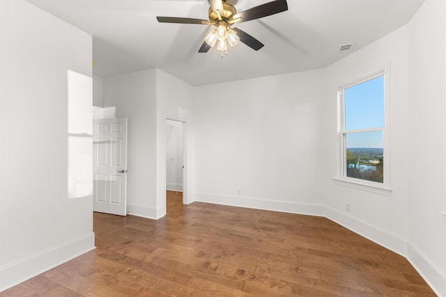 spare room with ceiling fan and hardwood / wood-style floors