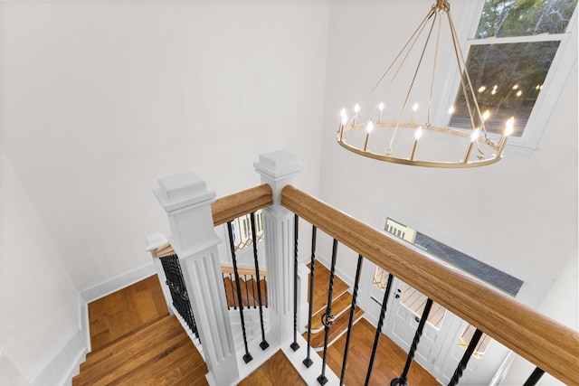 stairs featuring hardwood / wood-style flooring