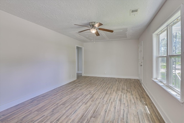 2001 Hiram Rd, Augusta, GA 30904 - spare room with wood finished floors, a textured ceiling, and a ceiling fan
