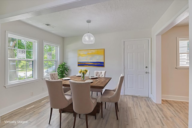 2001 Hiram Rd, Augusta, GA 30904 - dining room with light wood-style floors and a textured ceiling