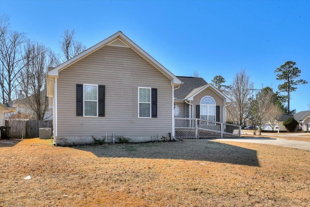 view of front facade with central AC unit and a front yard