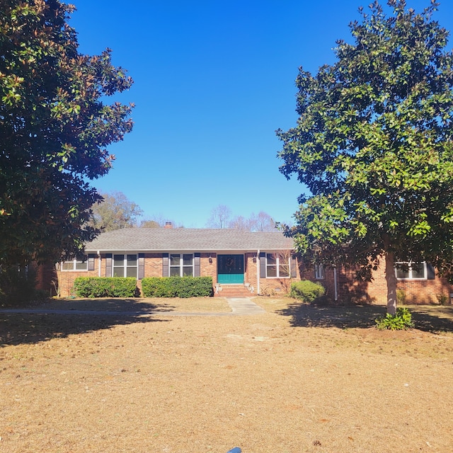 ranch-style house with brick siding