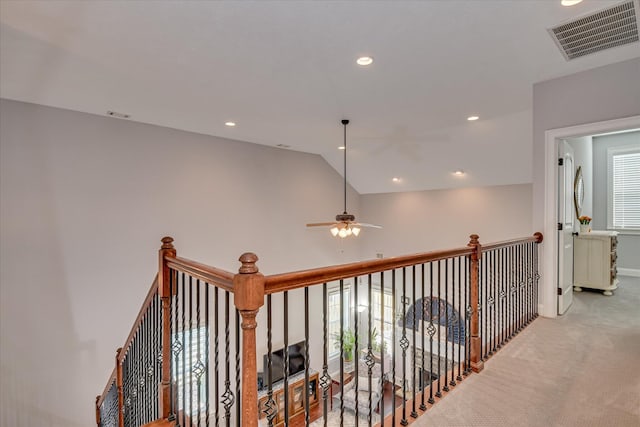 corridor with carpet flooring, lofted ceiling, recessed lighting, and baseboards