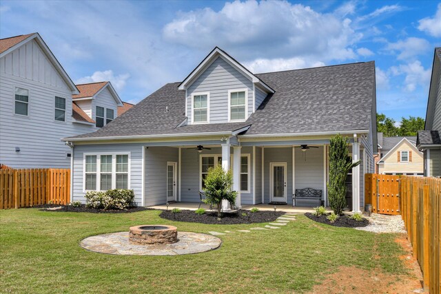 view of front of home featuring ceiling fan, an outdoor fire pit, a shingled roof, and a patio area